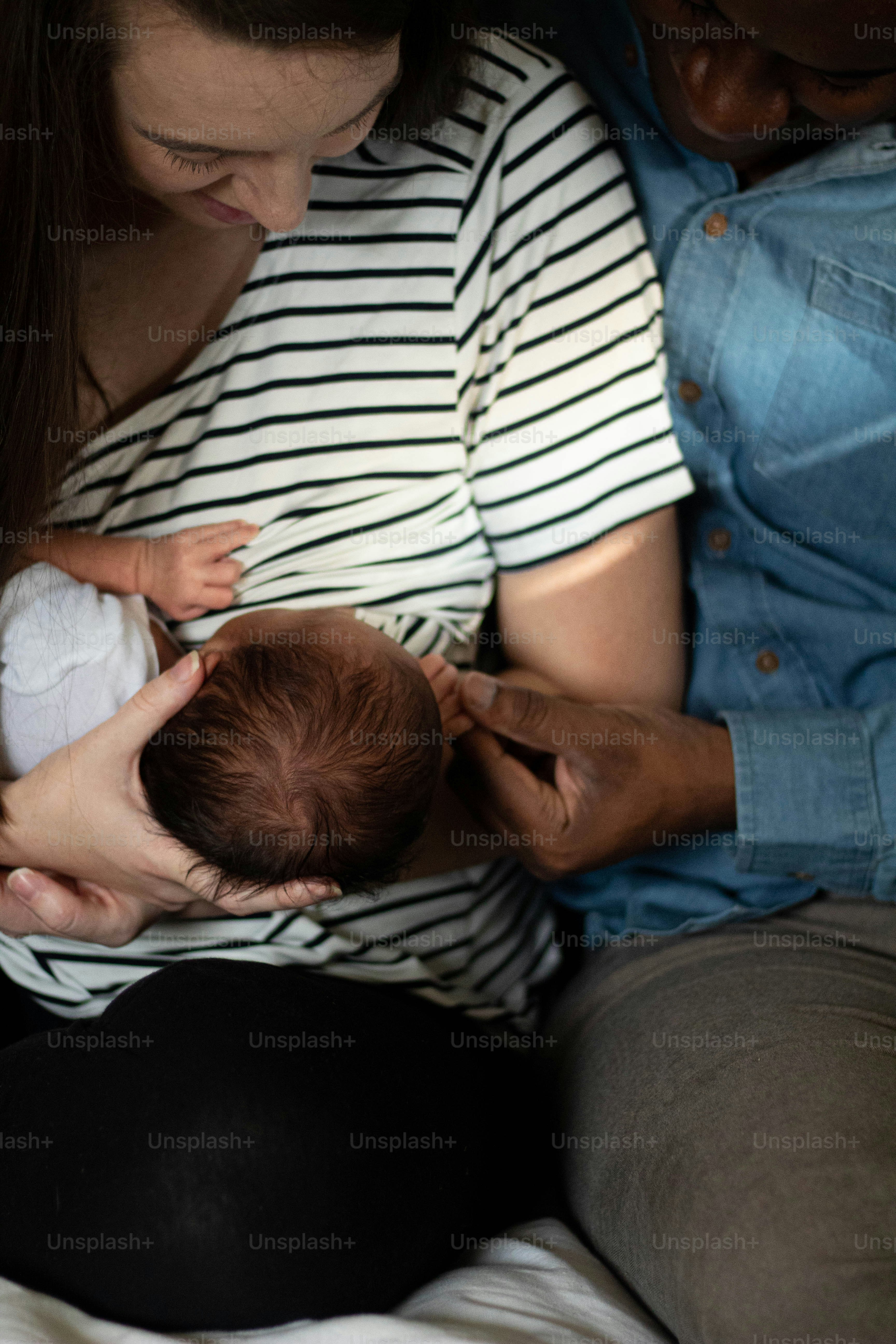 a woman holding a baby in her arms