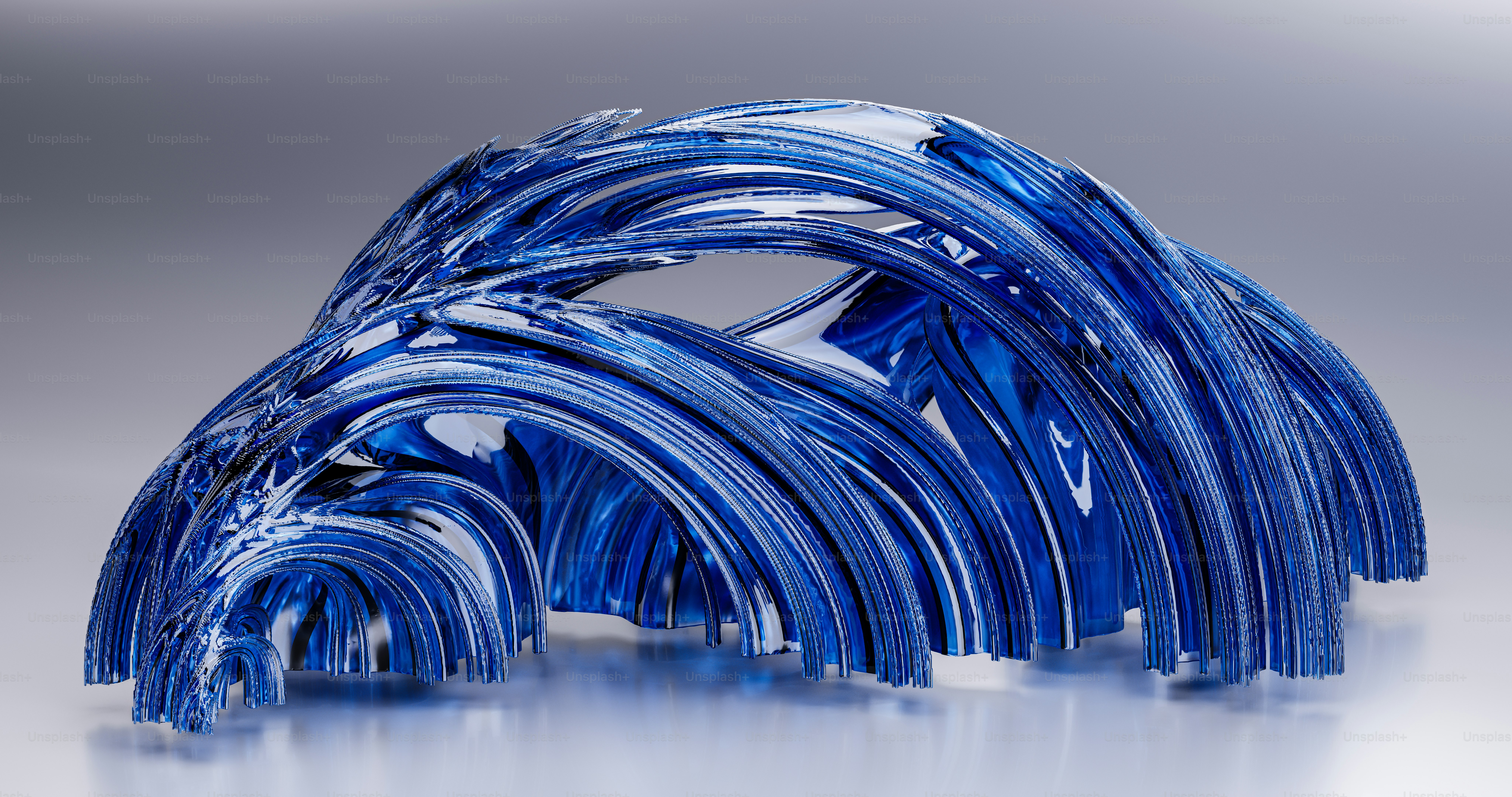 A group of blue glass tubes sitting on top of a table photo – Fractal ...
