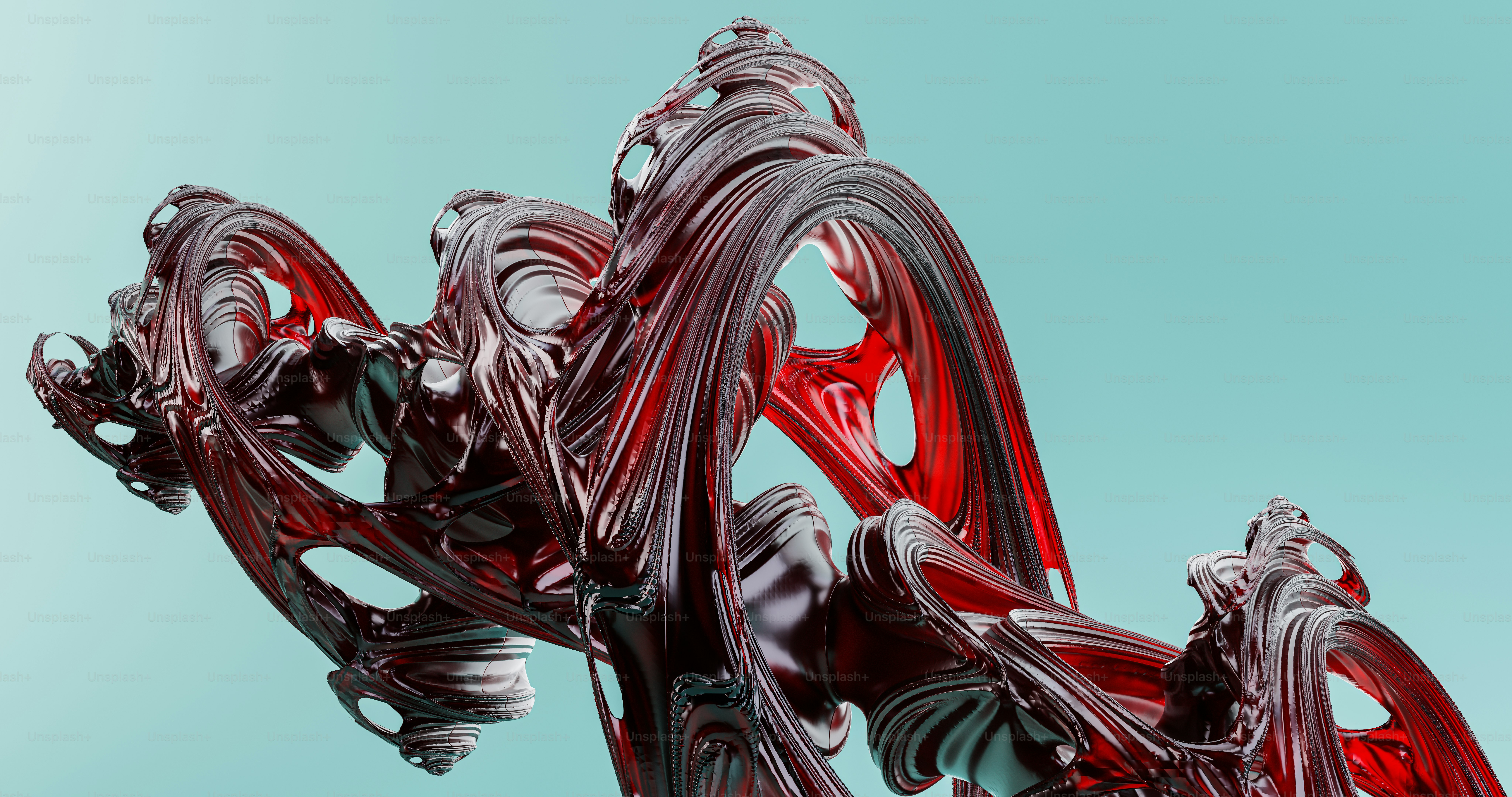 a close up of a red sculpture against a blue background