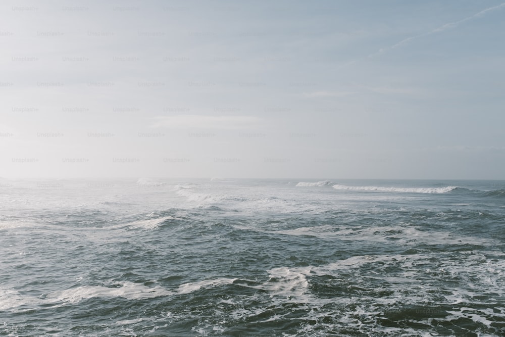 a body of water with waves coming in to shore