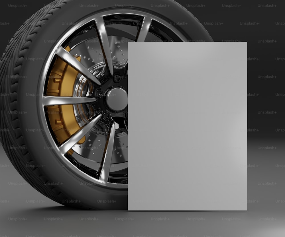 a close up of a car wheel with a blank card