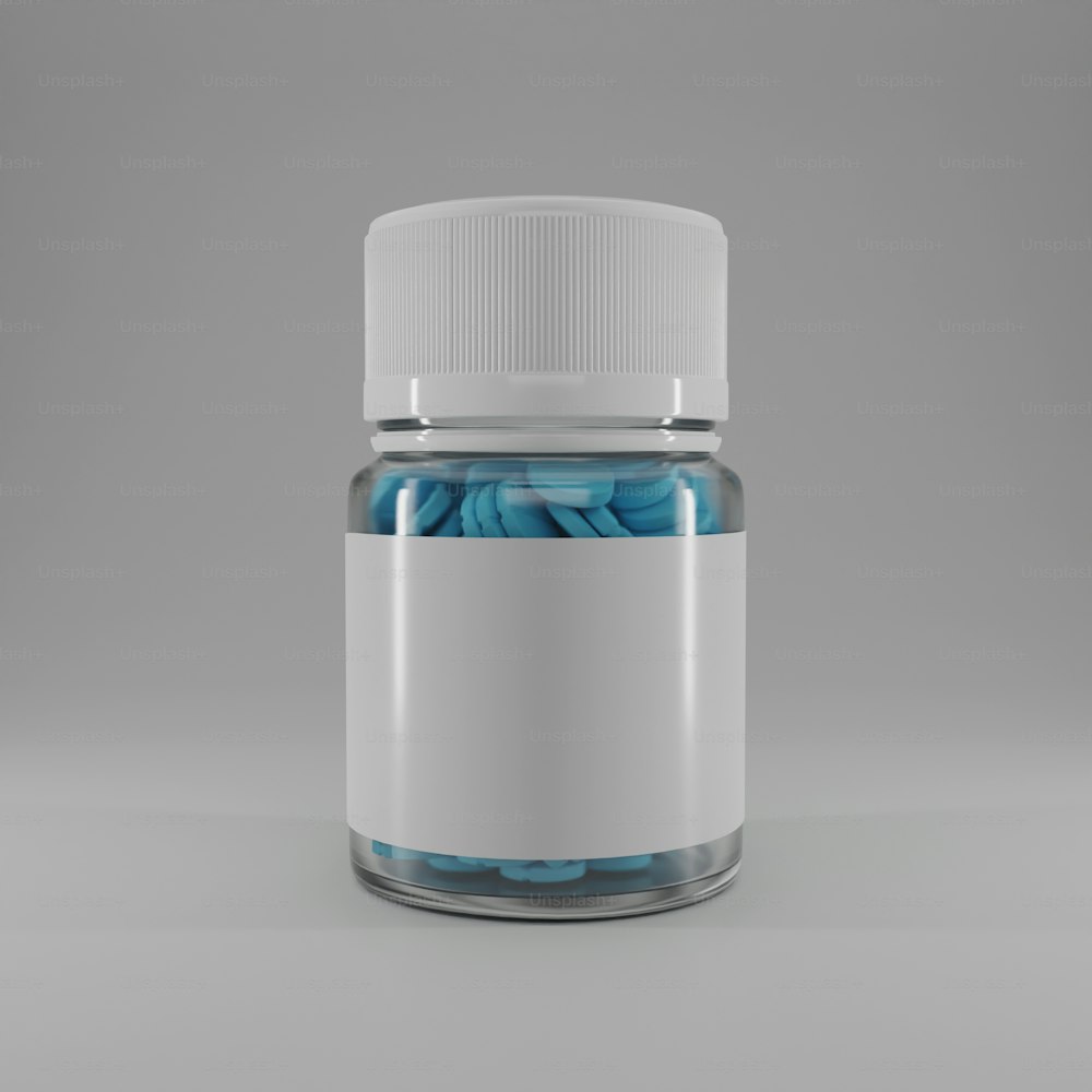 a glass jar filled with blue pills