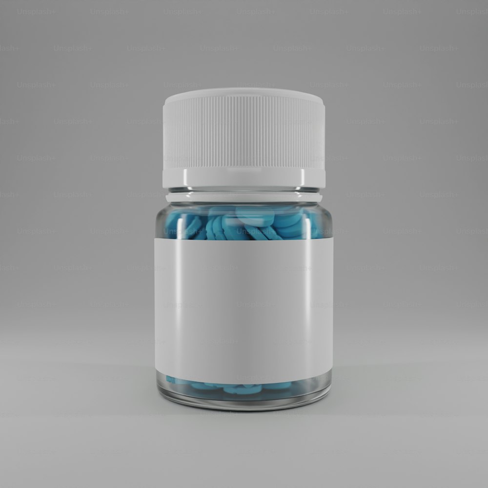 a glass jar filled with blue pills