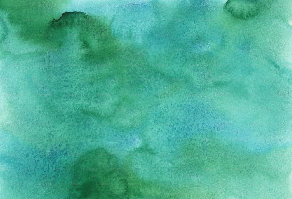 a watercolor painting of green and blue