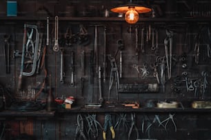 a bunch of tools hanging on a wall
