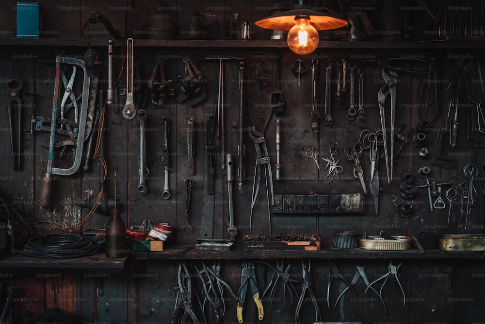 a bunch of tools hanging on a wall