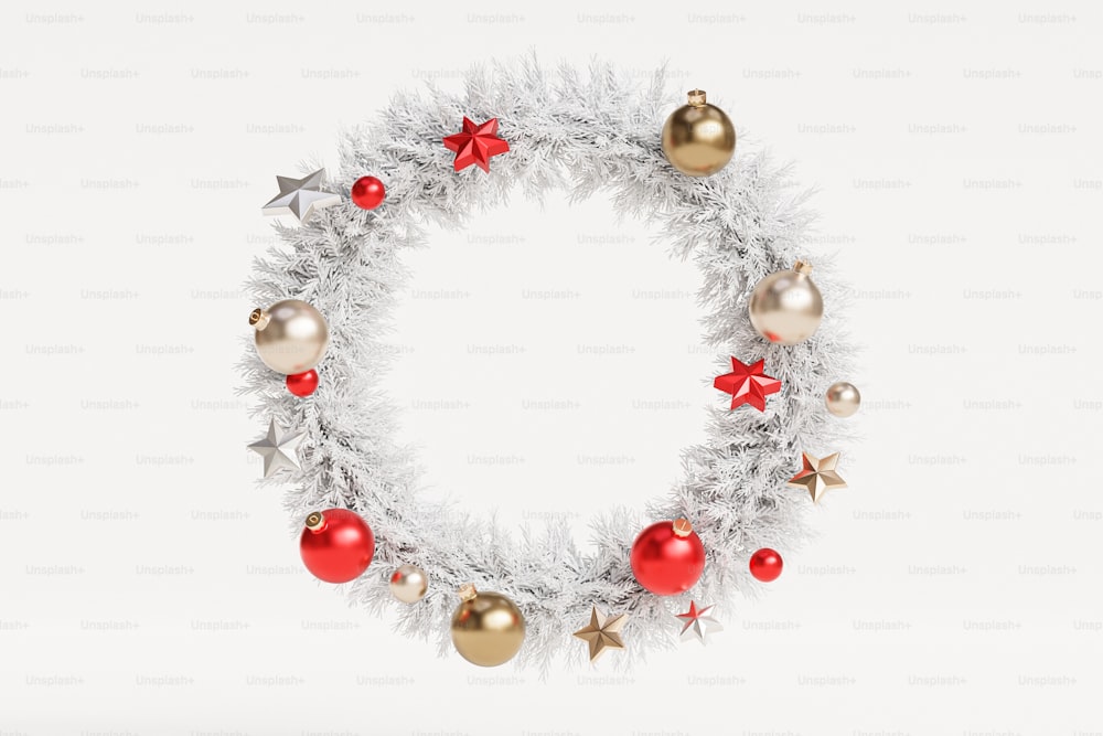 a white christmas wreath with red and gold ornaments