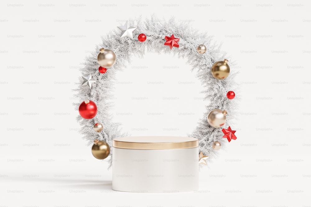 a white container with a christmas wreath on top of it