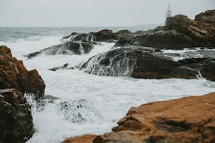 a couple of rocks that are in the water