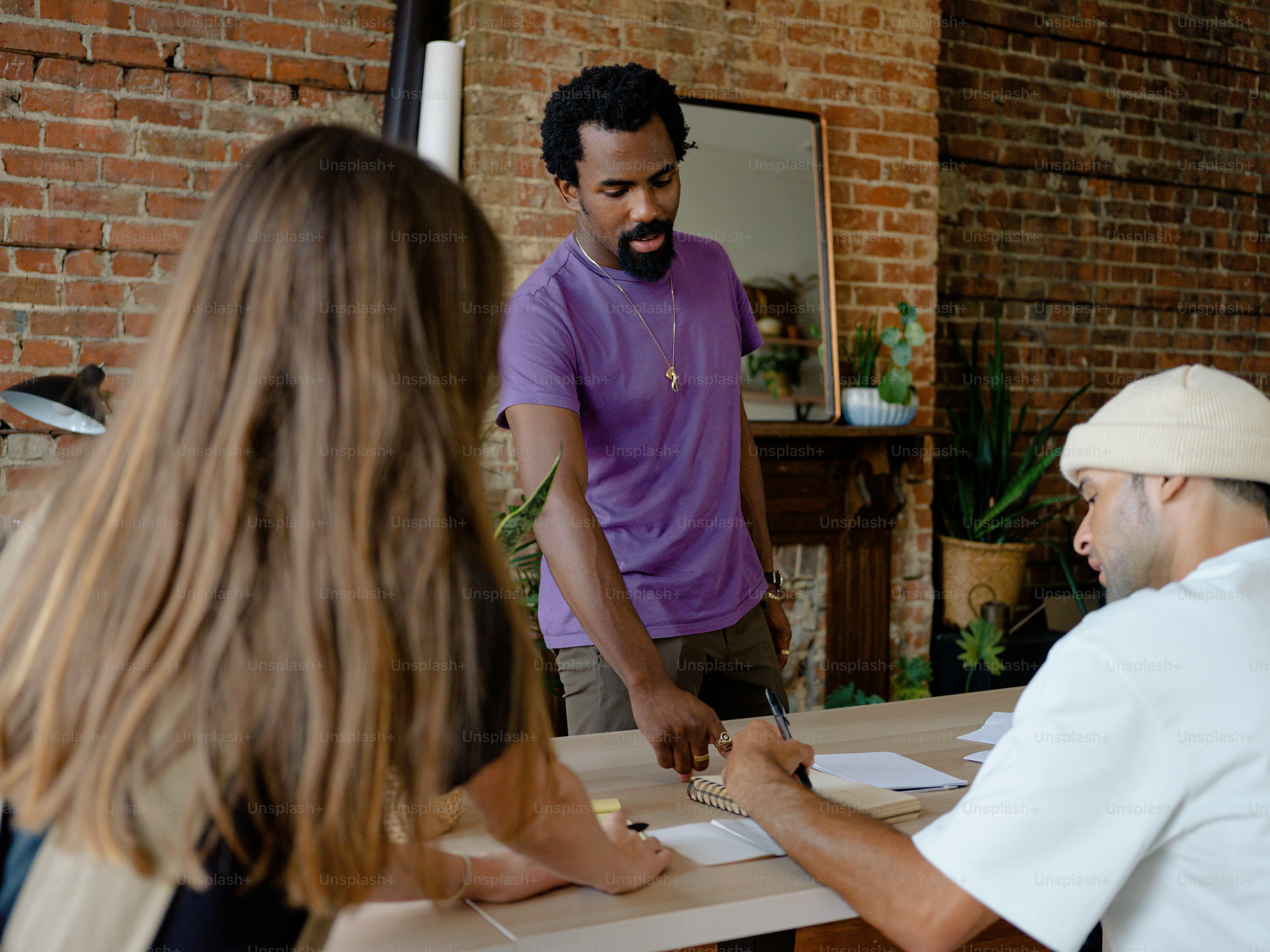 a group of people sitting around a table
