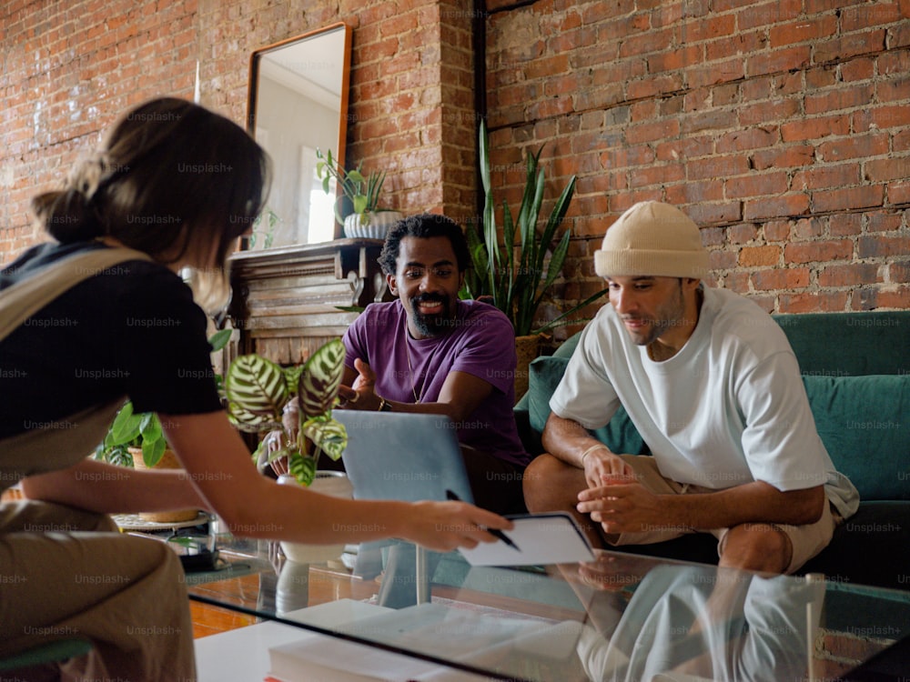 a group of people sitting around a glass table