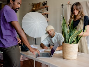 a man in a turban is looking at a laptop