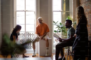 a group of people sitting around a window