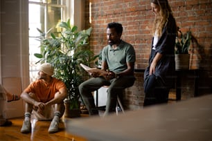 a group of people sitting around a living room