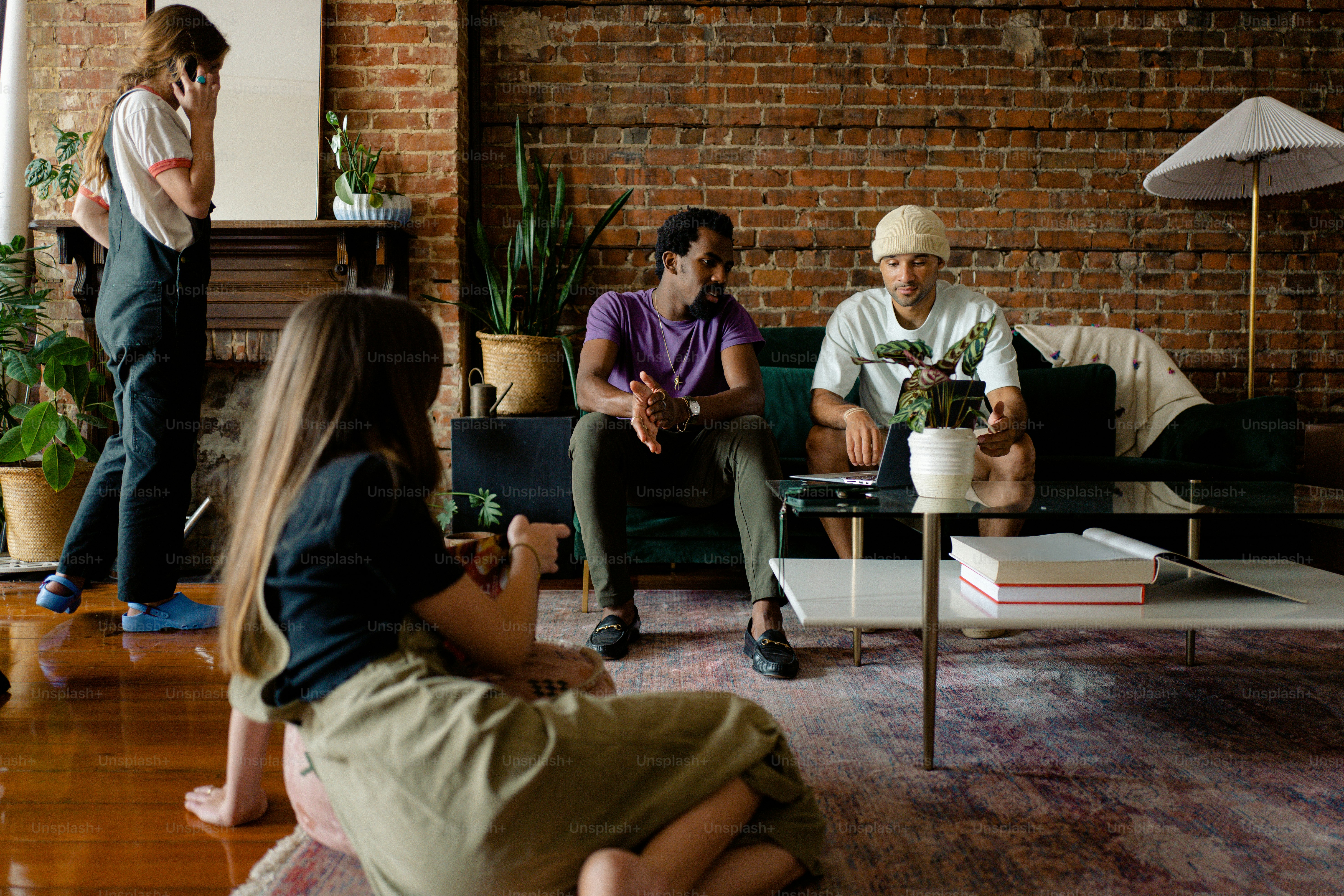 a group of people sitting around a living room