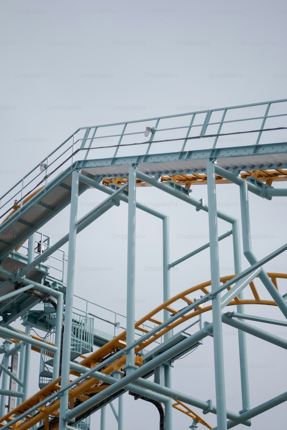 a large metal structure with a sky background