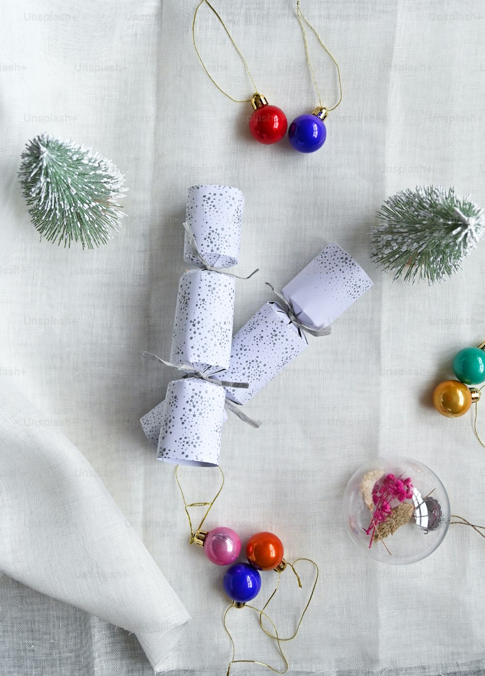 a white table topped with lots of christmas decorations