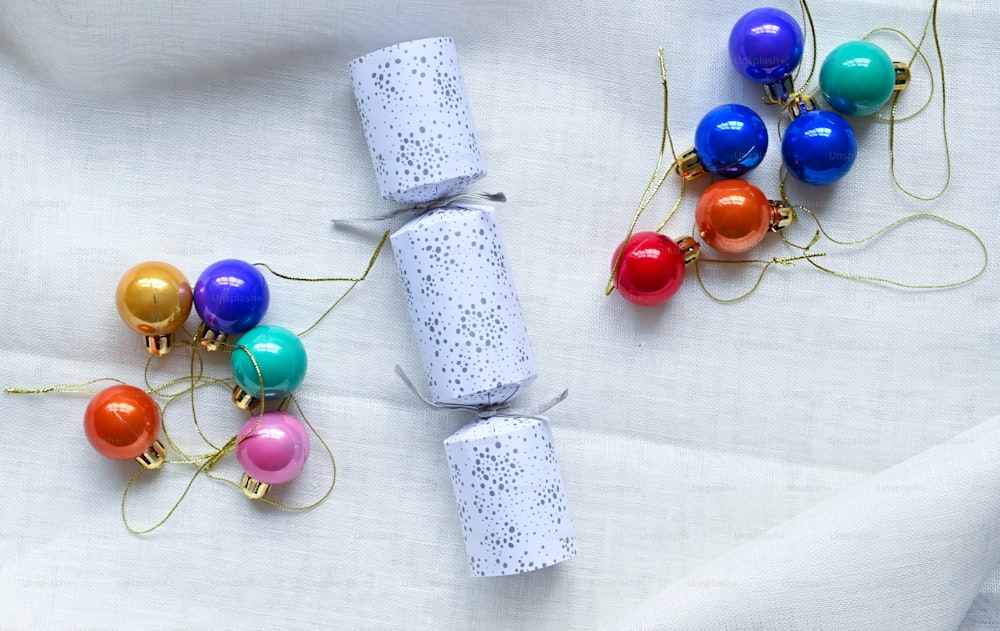 a roll of toilet paper sitting next to a bunch of christmas ornaments
