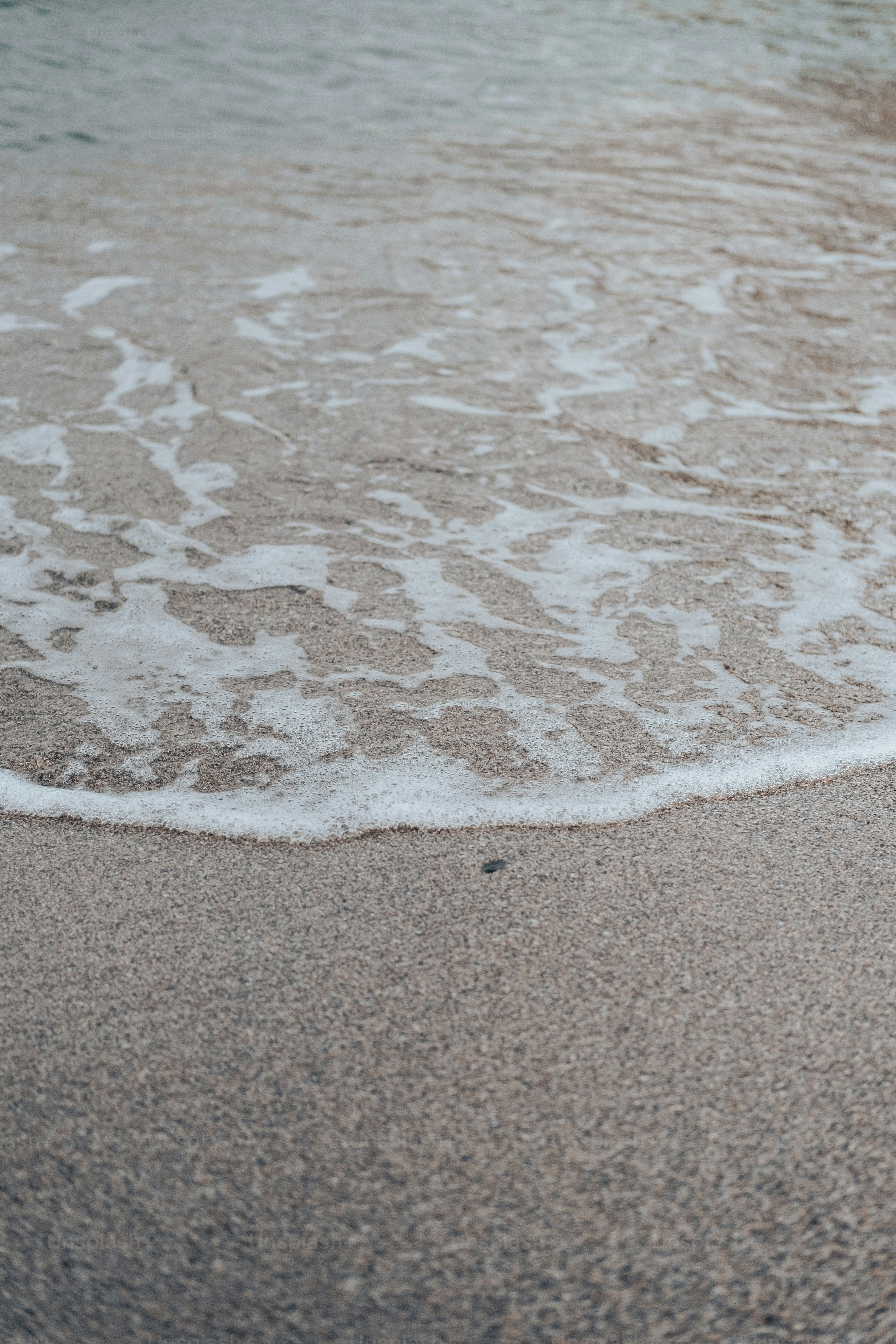 a close up of a wave coming in to the shore