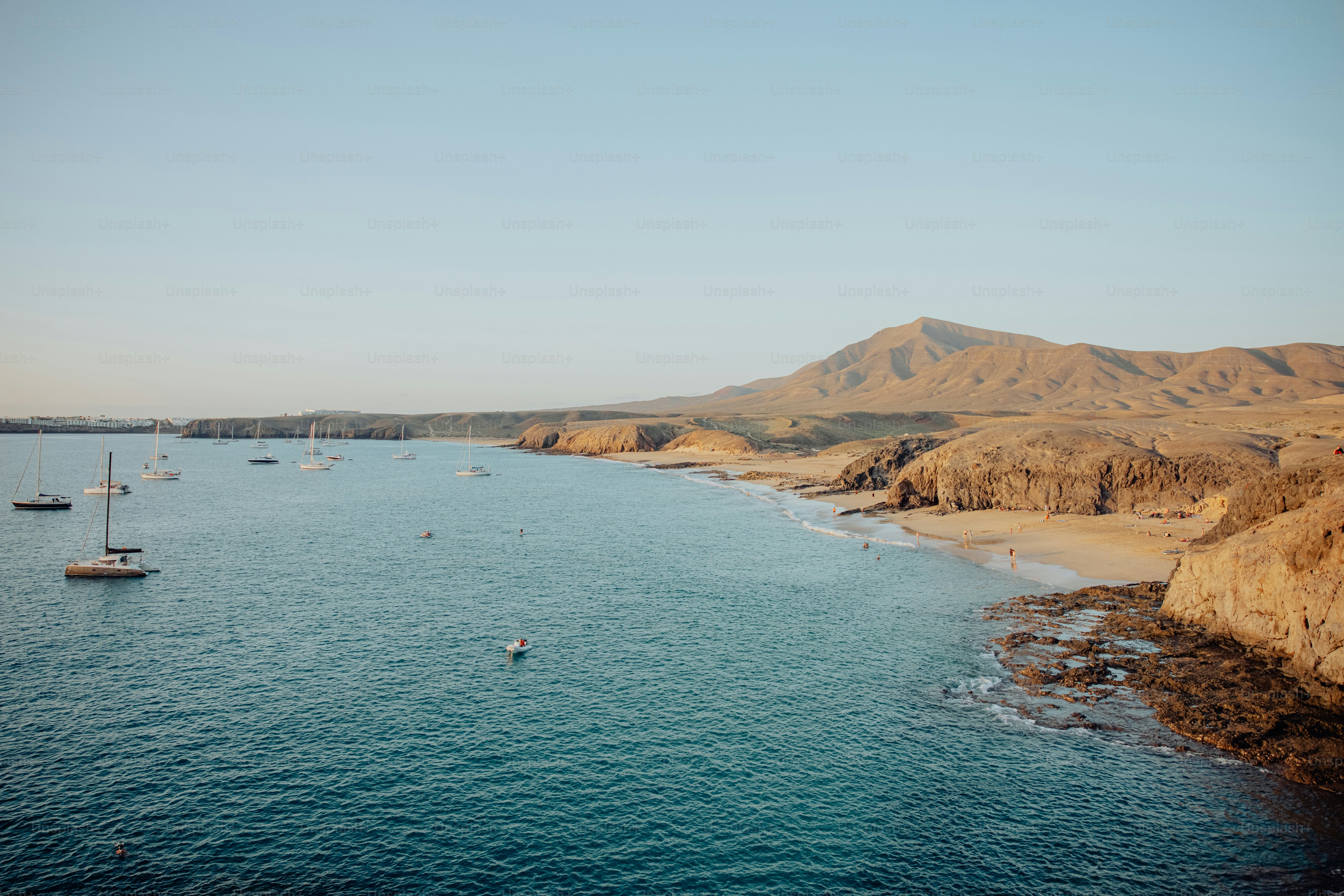 a body of water with boats floating on top of it