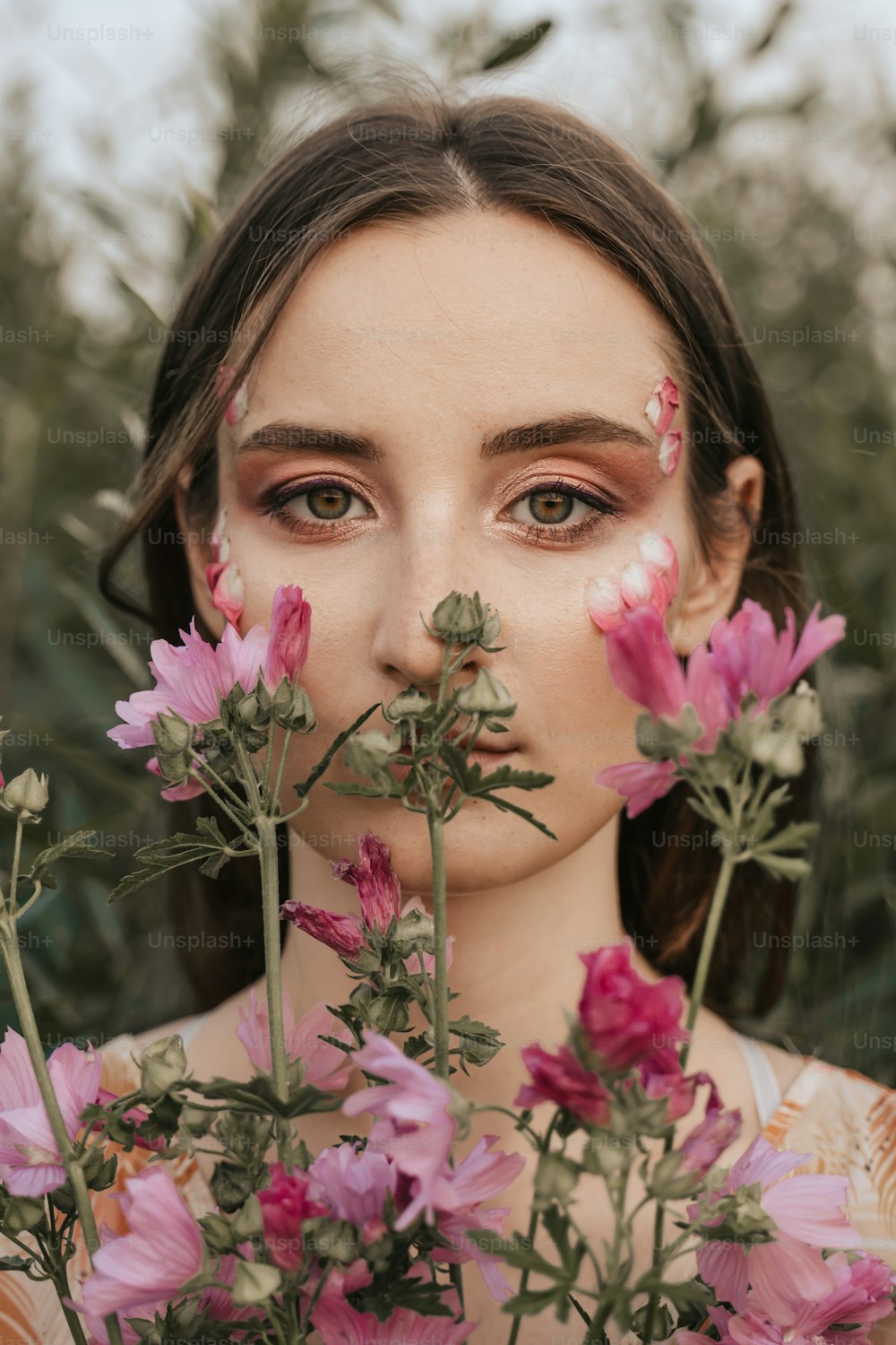 a woman with flowers around her face