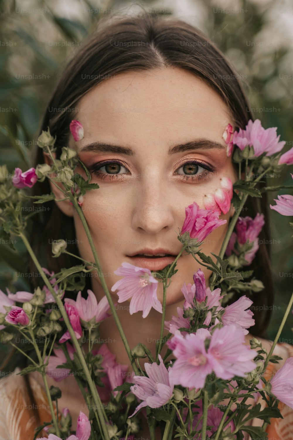 a woman with flowers around her face