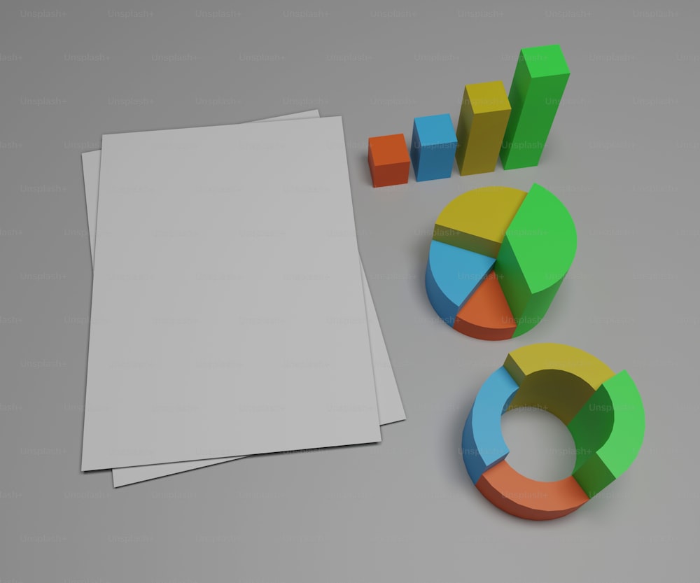 un foglio di carta bianco accanto ad alcune forme colorate