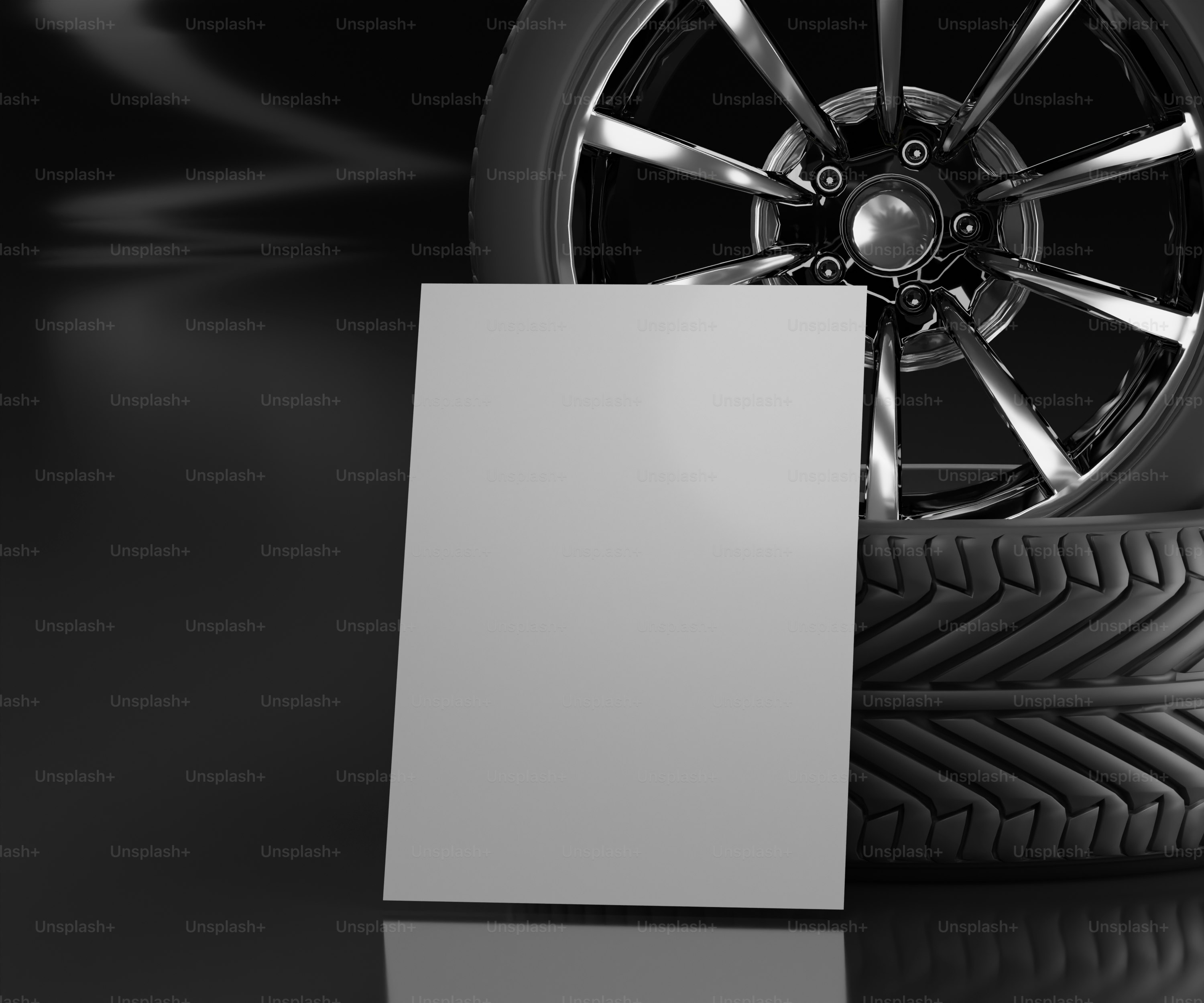 a car tire with a blank card next to it