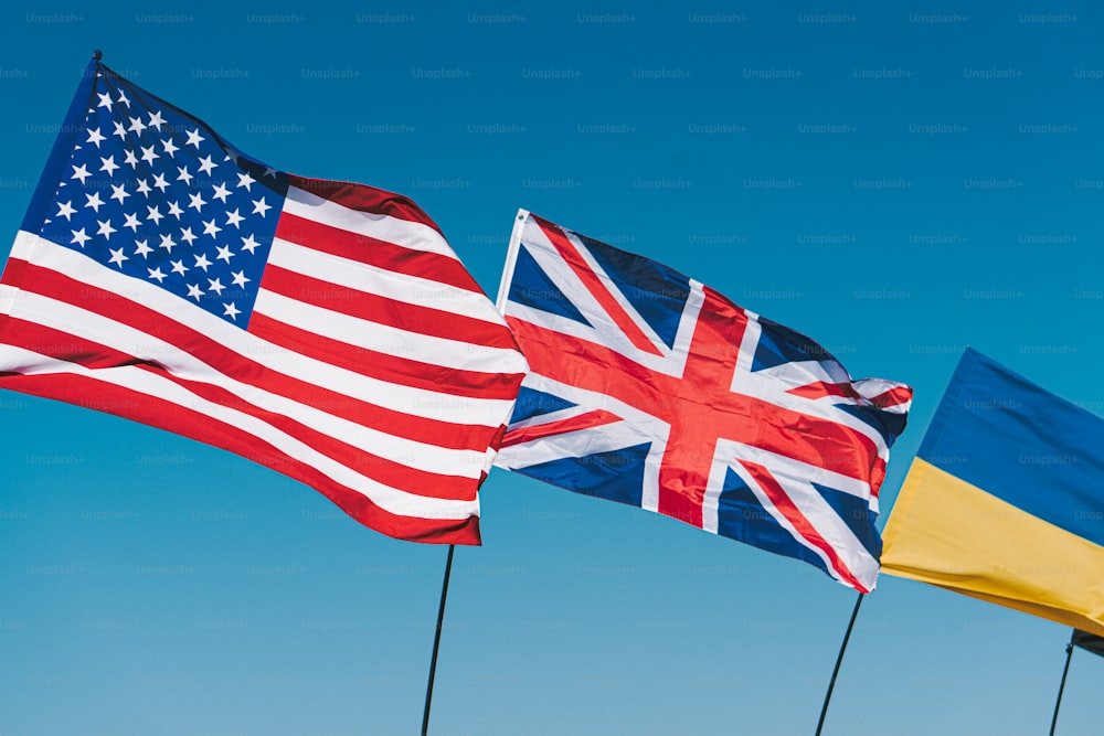 a group of flags flying in the air