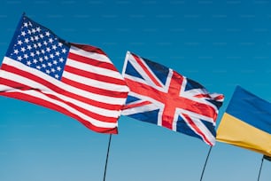 a group of flags flying in the air