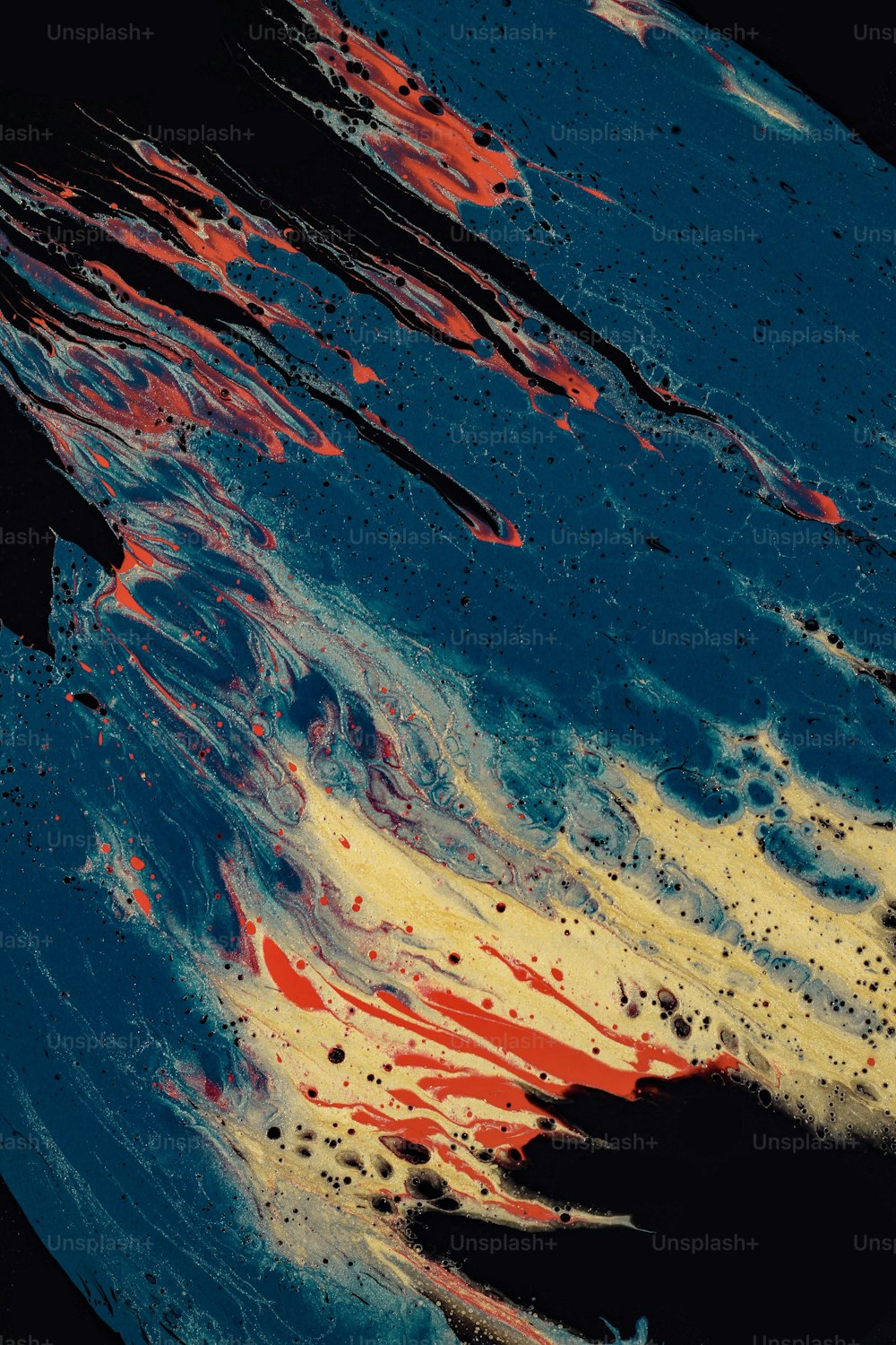 a close up of a blue, yellow and red substance