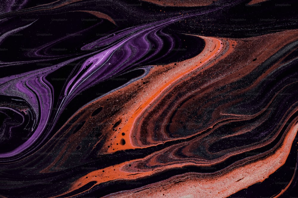 a close up of a purple and black surface
