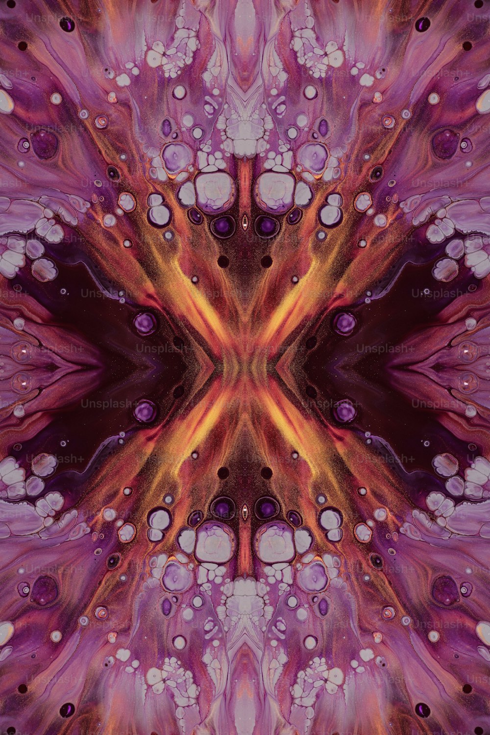 an abstract image of a purple and orange flower