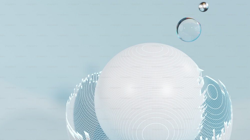 Una bola blanca flotando en el aire junto a una gota de agua