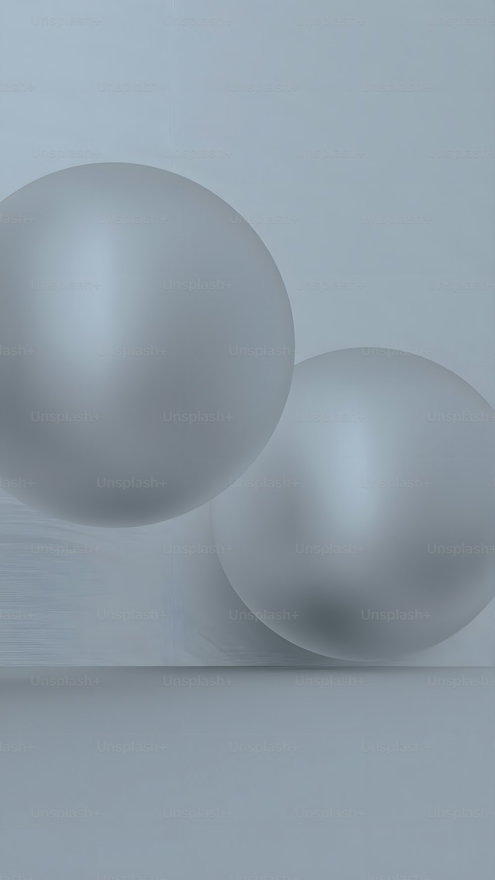 two white balls sitting on top of a table