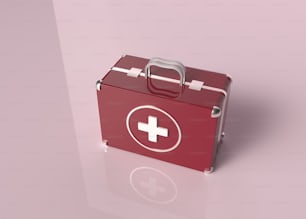 ein roter Erste-Hilfe-Kasten, der auf einem Tisch sitzt