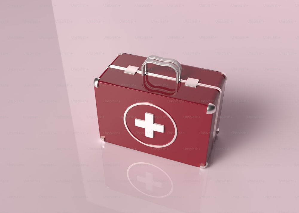 a red first aid kit sitting on top of a table