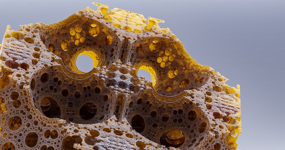 a close up of a rock with holes in it