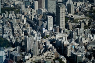 an aerial view of a city with tall buildings