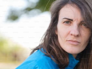 a close up of a person wearing a blue shirt