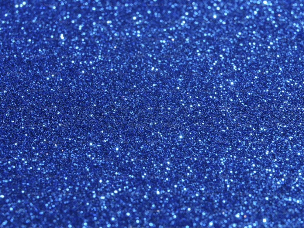 ein blauer Glitzerhintergrund mit vielen kleinen Punkten