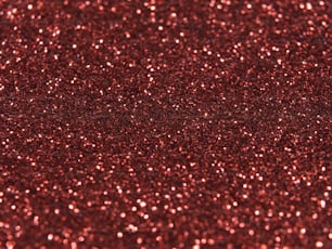 a close up of a red glitter background