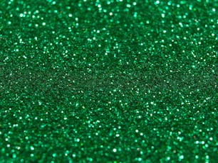 a close up of a green glitter background