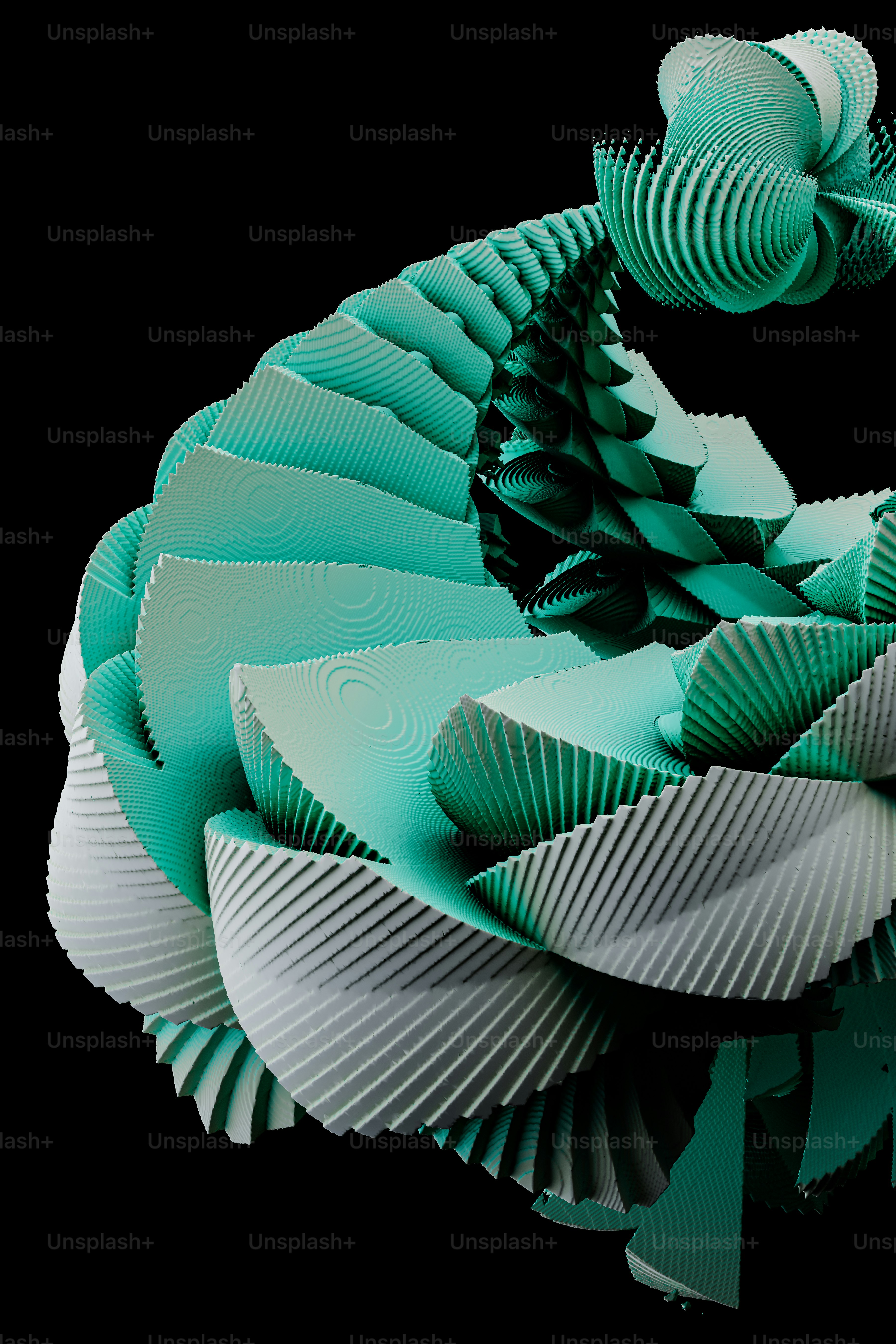 a green and white paper sculpture on a black background