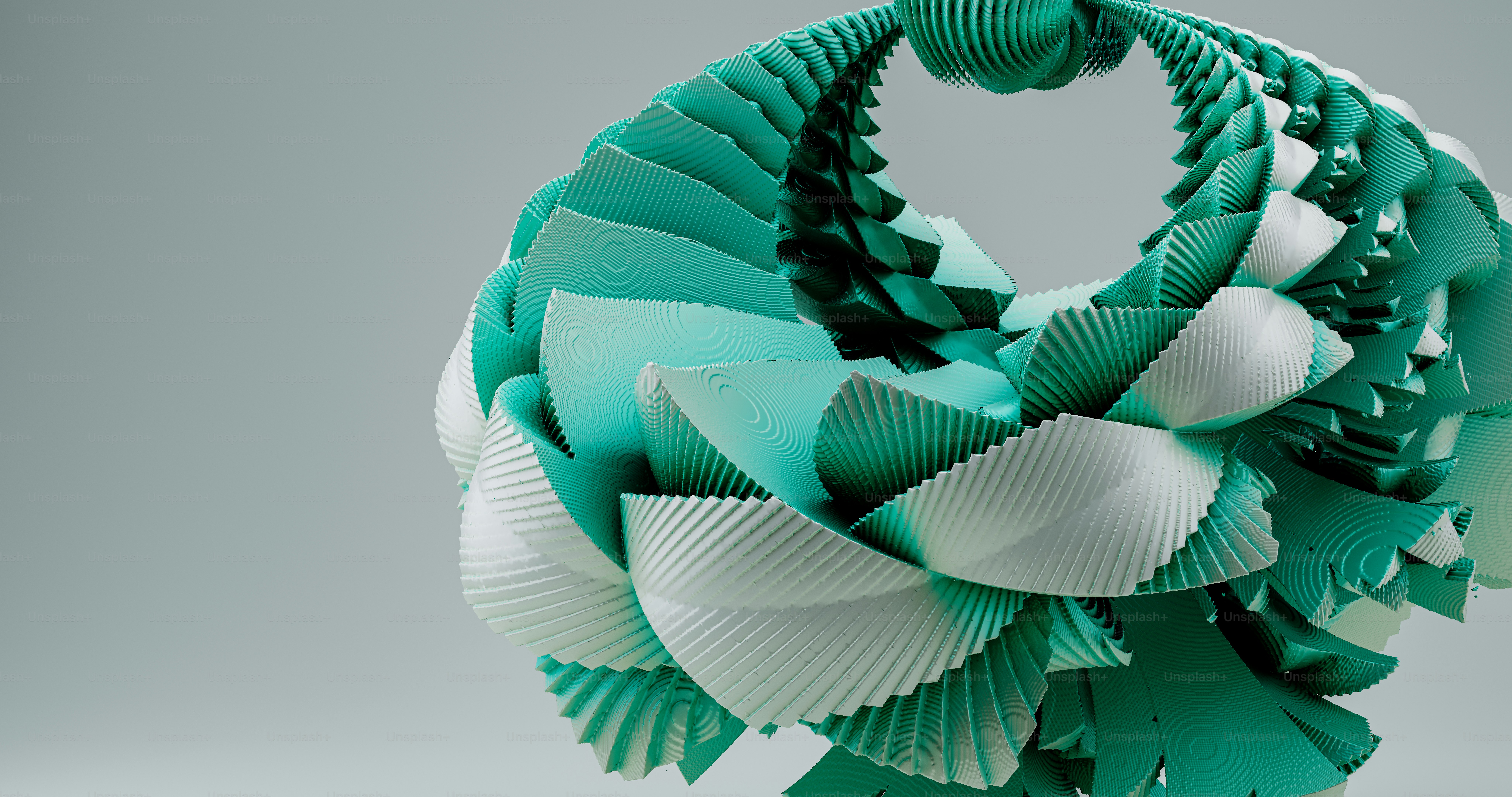 a green and white sculpture made of folded paper