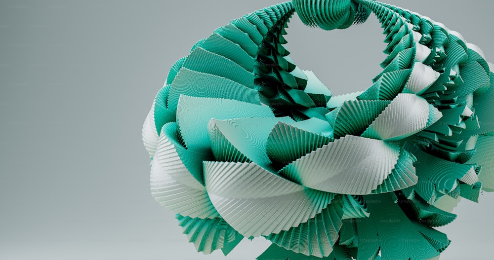 a green and white sculpture made of folded paper