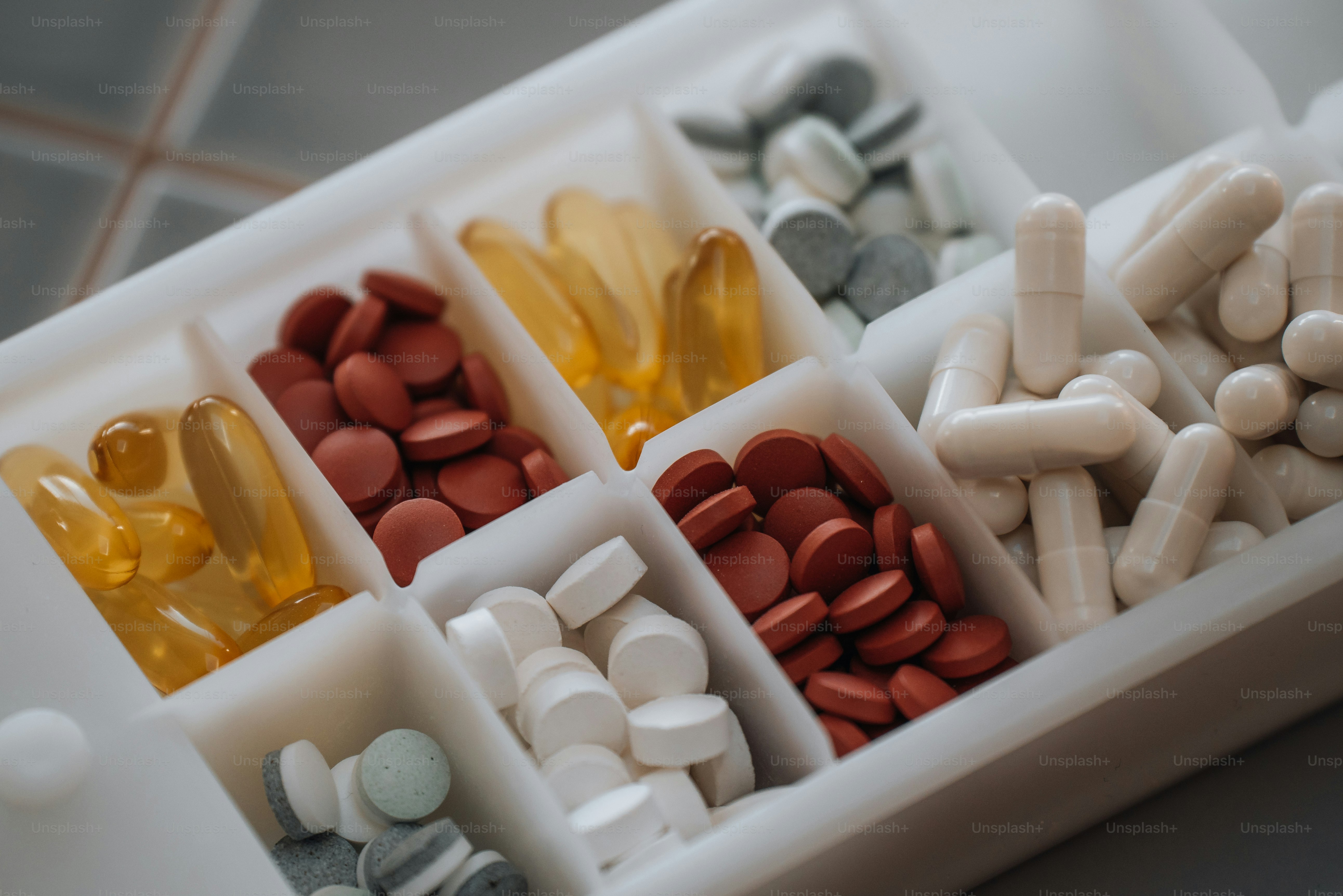 a close up of a pill box filled with pills