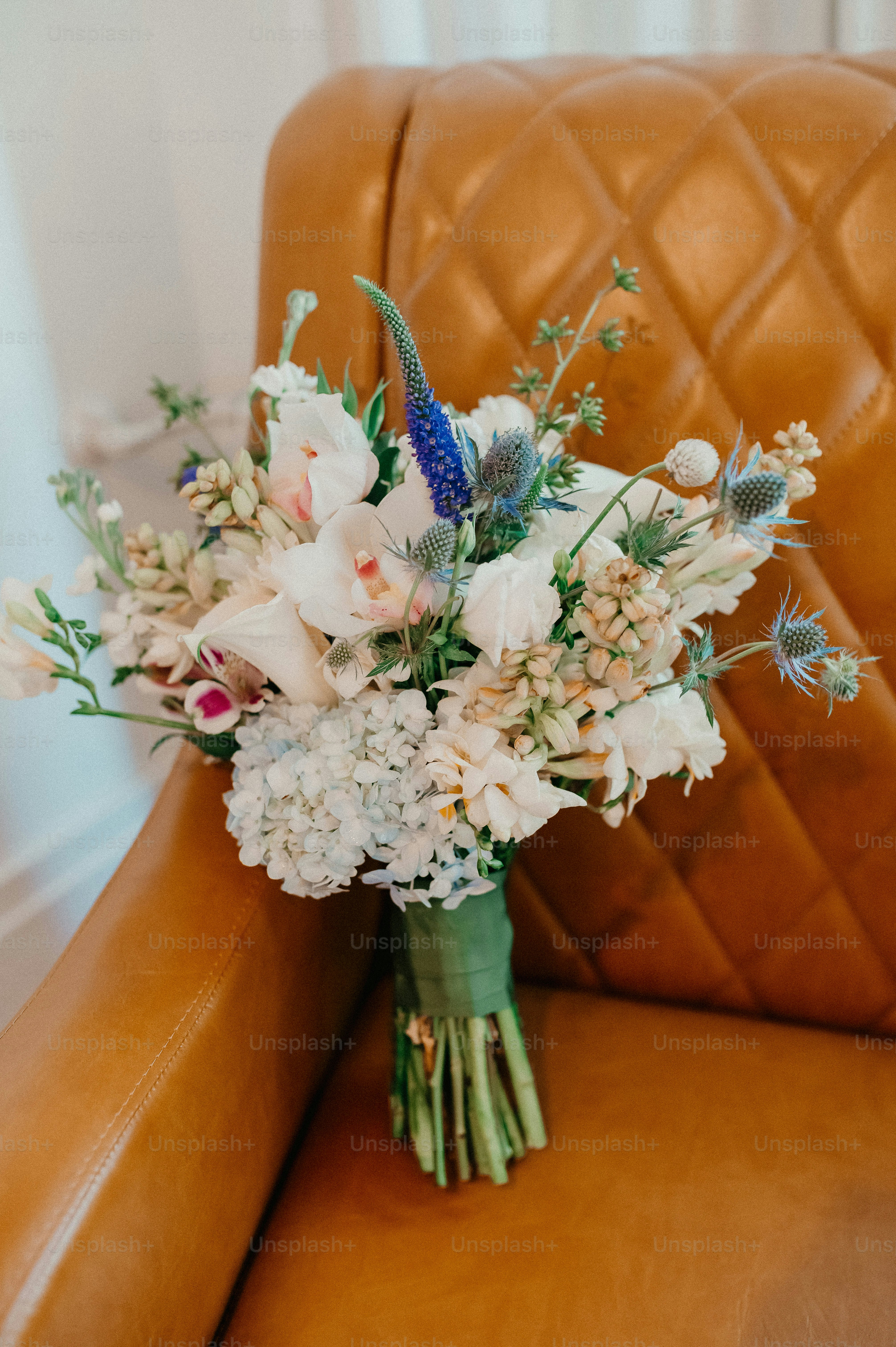 a bouquet of flowers is sitting on a chair