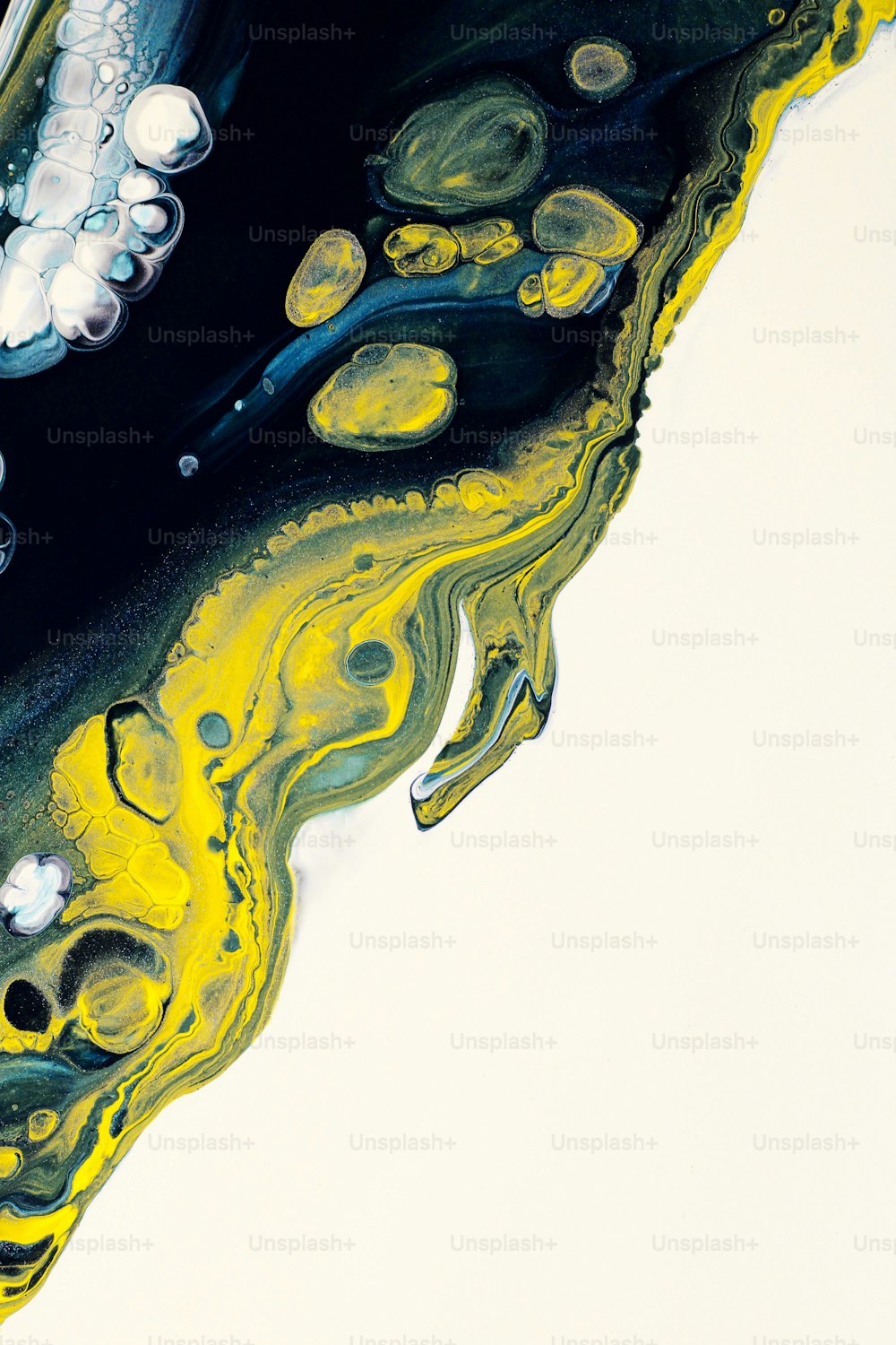a close up of a yellow and black liquid