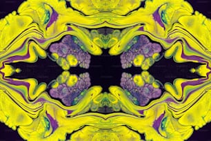 an abstract image of a yellow and purple flower